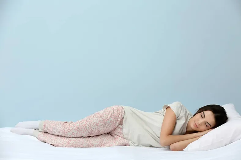 woman sleeping comfortably on mattress